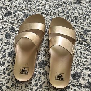 Reef Gold Slide Sandals with Modern Minimalist Design